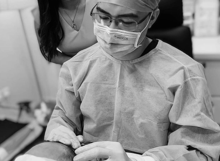 Hair Transplant in Malaysia – How Long Do Results Last? Male patient checking new hair growth after a successful hair transplant in Malaysia under professional clinic supervision.