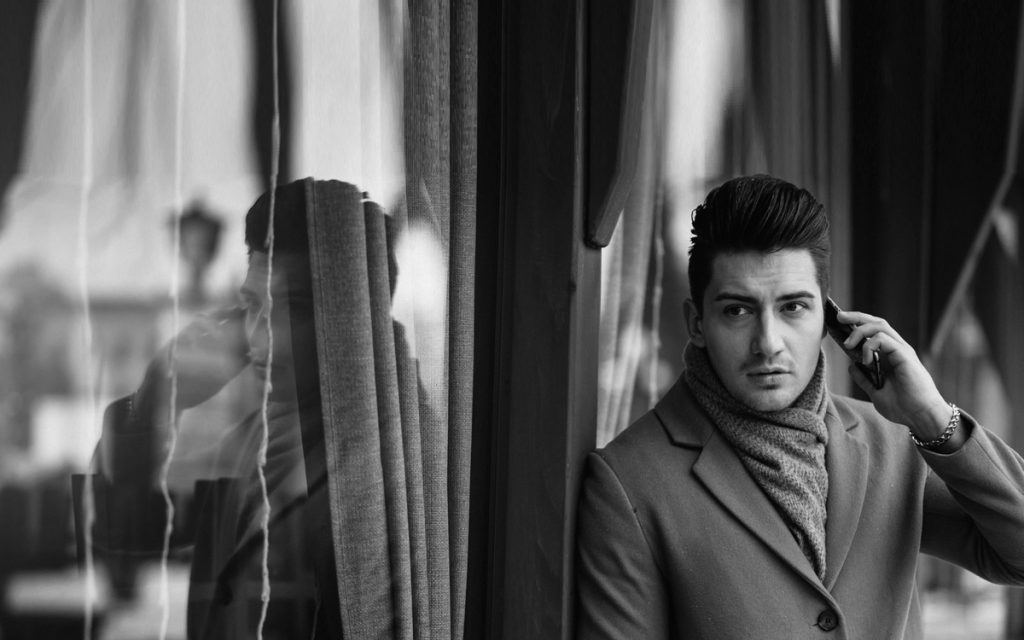 Young man discussing hair restoration options with a specialist in Malaysia to decide the right time for a transplant.