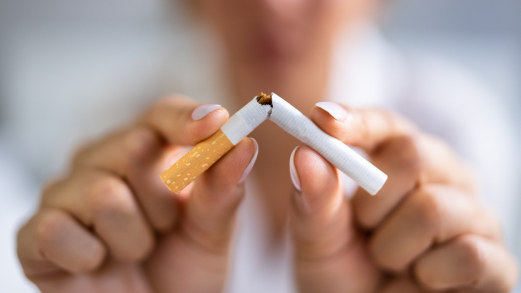Man holding a cigarette after a hair transplant with healing grafts on the scalp. Does Smoking Affect Hair Transplant Results?
